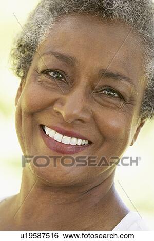 Stock Photograph - Senior Woman Smiling At The Camera. Fotosearch