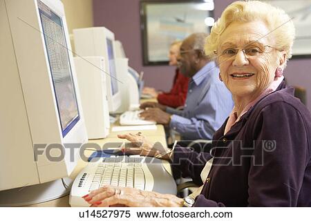 Senior woman using computer View Large Photo Image Stock Photography - Senior woman using computer. Fotosearch
