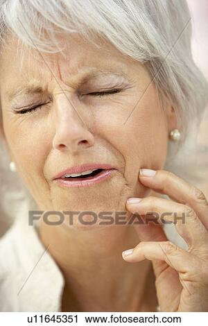 Stock Image - Senior Woman With A Toothache. Fotosearch