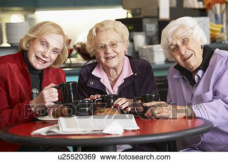 Stock Photo - Senior women drinking tea together. Fotosearch
