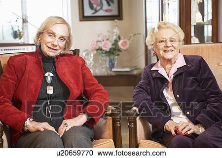 Senior women relaxing in armchairs View Large Photo Image Stock Image - Senior women relaxing in armchairs. Fotosearch