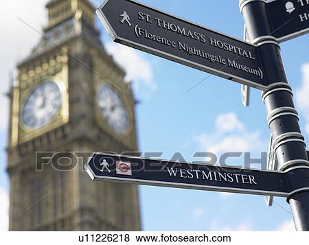 Stock Photo - Sign Post In Front Of Big Ben, London, England. Fotosearch