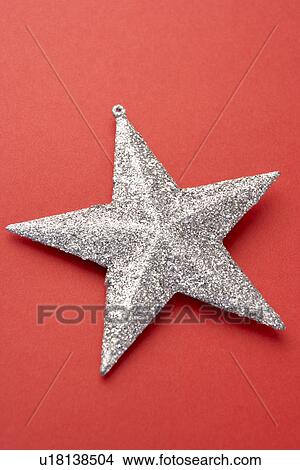 Silver Star Christmas Tree Decoration On Red Background View Large Photo Image Picture - Silver Star Christmas Tree Decoration On Red Background. Fotosearch