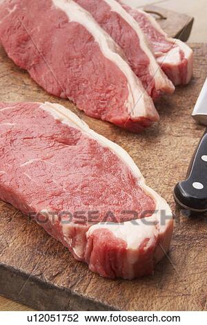 Sliced Steak On Wooden Cutting Board View Large Photo Image Stock Image - Sliced Steak On Wooden Cutting Board. Fotosearch