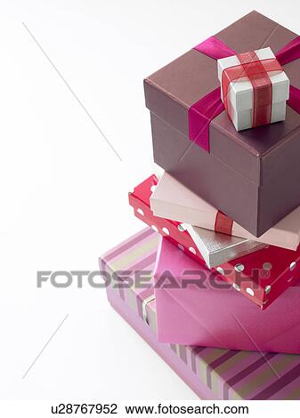 Stock Image - Stack Of Pink Wrapped Presents. Fotosearch