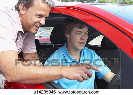 Stock Photograph - Teenage Boy Learning How To Drive. Fotosearch