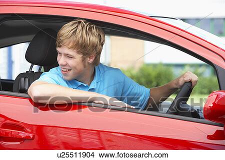 Picture - Teenage Boy Sitting In Car. Fotosearch