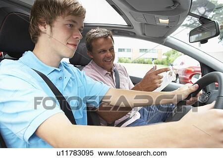Teenage Boy Taking A Driving Lesson View Large Photo Image Stock Photography - Teenage Boy Taking A Driving Lesson. Fotosearch