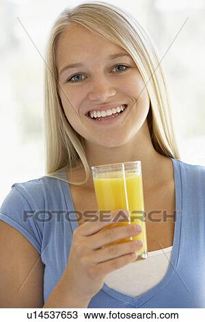 Teenage Girl Drinking A Glass Of Orange Juice View Large Photo Image Stock Image - Teenage Girl Drinking A Glass Of Orange Juice. Fotosearch