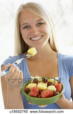 Teenage Girl Eating Fresh Fruit Salad View Large Photo Image Stock Image - Teenage Girl Eating Fresh Fruit Salad. Fotosearch