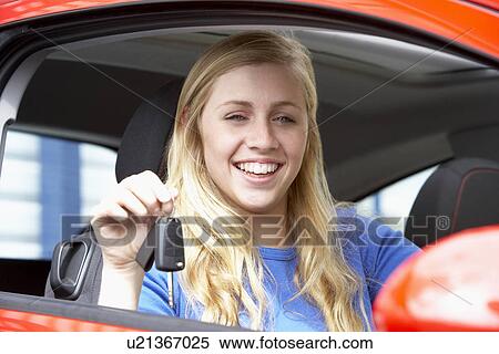 Teenage Girl Sitting In Car, Holding Car Keys And Smiling At The Camera View Large Photo Image Stock Photography - Teenage Girl Sitting In Car, Holding Car Keys And Smiling At The Camera. Fotosearch
