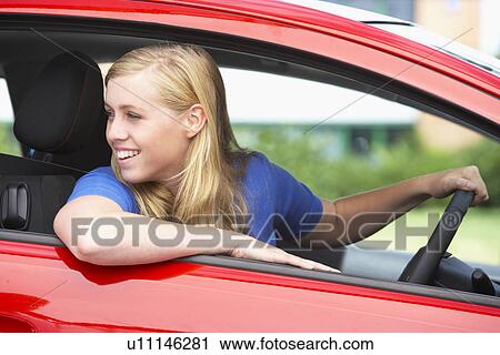 Stock Image - Teenage Girl Sitting In Car. Fotosearch