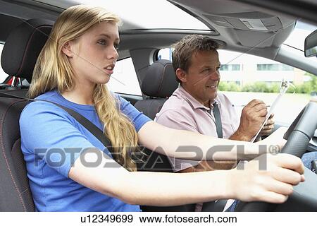 Teenage Girl Taking A Driving Lesson View Large Photo Image Stock Photo - Teenage Girl Taking A Driving Lesson. Fotosearch