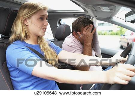 Stock Photo - Teenage Girl Taking A Driving Lesson. Fotosearch