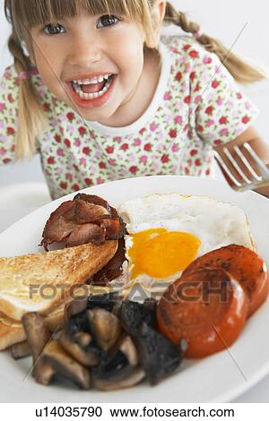 Toddler Eating Unhealthy Breakfast View Large Photo Image Stock Image - Toddler Eating Unhealthy Breakfast. Fotosearch