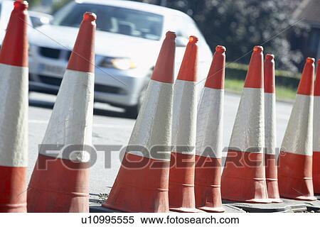 Stock Photography - Traffic Cones Lined Up On The Side Of The Road. Fotosearch