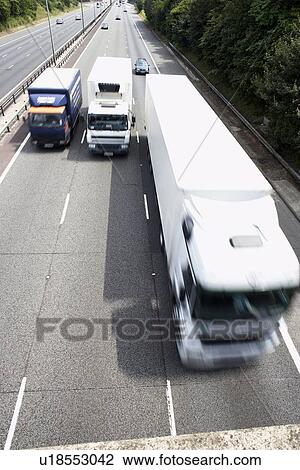 Trucks Side By Side On Highway View Large Photo Image Stock Image - Trucks Side By Side On Highway. Fotosearch