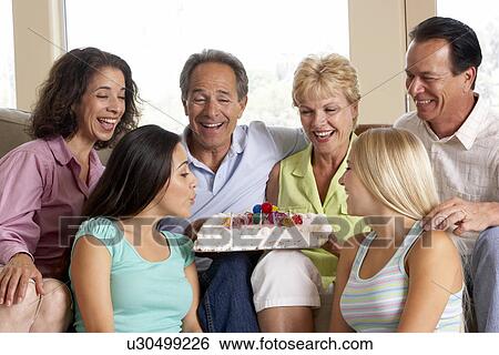 Two Families Celebrating A Birthday Together View Large Photo Image Stock Photograph - Two Families Celebrating A Birthday Together. Fotosearch