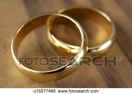 Two Wedding Rings Resting Together View Large Photo Image Stock Photo - Two Wedding Rings Resting Together. Fotosearch