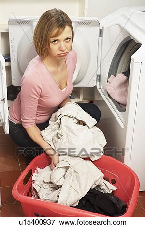 Unhappy Woman Doing Laundry View Large Photo Image Stock Photo - Unhappy Woman Doing Laundry. Fotosearch