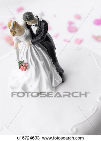 Stock Image - Wedding Cake With Bride And Groom Figurines. Fotosearch