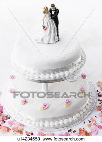 Stock Photo - Wedding Cake With Bride And Groom Figurines. Fotosearch