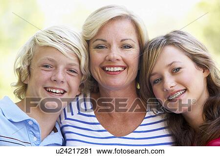 Stock Image - Woman And Her Teenage Children. Fotosearch