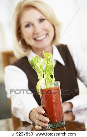 Stock Image - Woman Drinking A Bloody Mary. Fotosearch