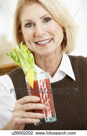 Woman Drinking A Bloody Mary View Large Photo Image Stock Image - Woman Drinking A Bloody Mary. Fotosearch