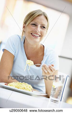 Woman Eating Lunch At A Cafe View Large Photo Image Stock Photo - Woman Eating Lunch At A Cafe. Fotosearch