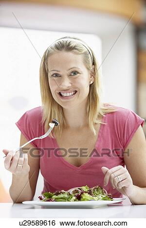 Woman Eating Lunch At A Cafe View Large Photo Image Stock Photograph - Woman Eating Lunch At A Cafe. Fotosearch