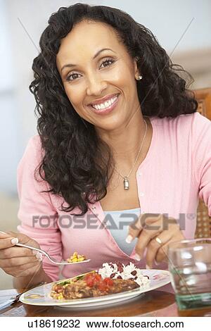 Woman Enjoying A Meal At Home View Large Photo Image Stock Image - Woman Enjoying A Meal At Home. Fotosearch