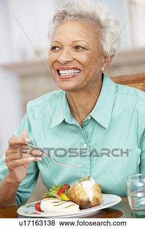 Woman Enjoying A Meal At Home View Large Photo Image Stock Photo - Woman Enjoying A Meal At Home. Fotosearch