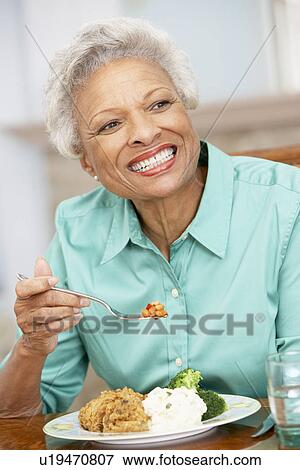 Woman Enjoying A Meal At Home View Large Photo Image Stock Photo - Woman Enjoying A Meal At Home. Fotosearch