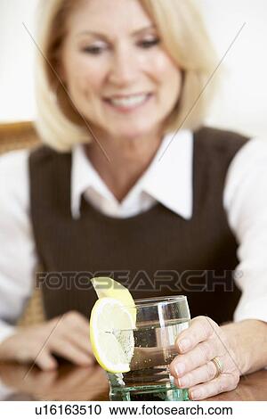 Woman Having A Drink At Home View Large Photo Image Stock Image - Woman Having A Drink At Home. Fotosearch