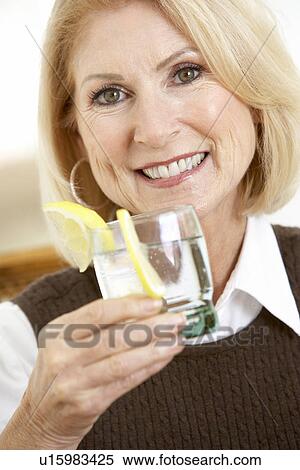 Woman Having A Drink At Home View Large Photo Image Stock Photography - Woman Having A Drink At Home. Fotosearch