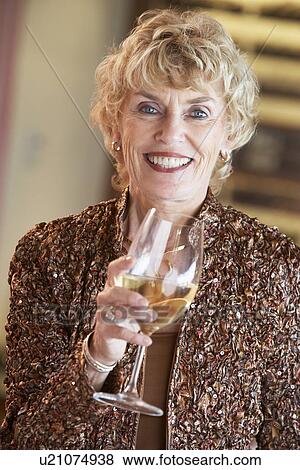 Woman Having A Glass Of Wine At A Bar View Large Photo Image Stock Photo - Woman Having A Glass Of Wine At A Bar. Fotosearch