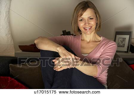 Stock Photography - Woman Relaxing Watching Television. Fotosearch
