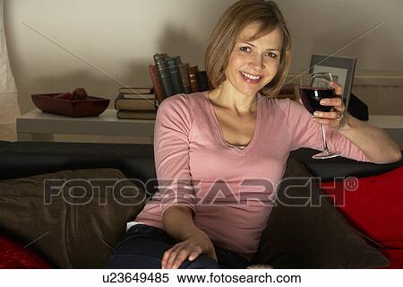 Woman Relaxing With Glass Of Wine Watching Television View Large Photo Image Stock Photography - Woman Relaxing With Glass Of Wine Watching Television. Fotosearch