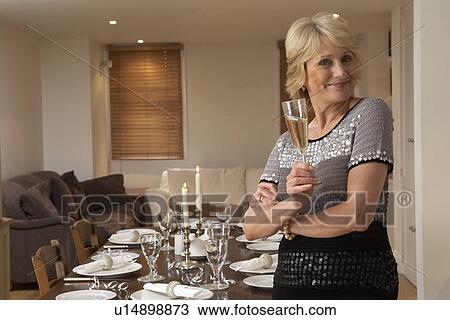 Woman Throwing A Dinner Party View Large Photo Image Stock Image - Woman Throwing A Dinner Party. Fotosearch