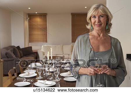 Woman Throwing A Dinner Party View Large Photo Image Stock Image - Woman Throwing A Dinner Party. Fotosearch