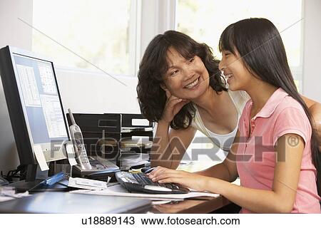 Woman Watching Her Daughter Use A Computer View Large Photo Image Stock Image - Woman Watching Her Daughter Use A Computer. Fotosearch