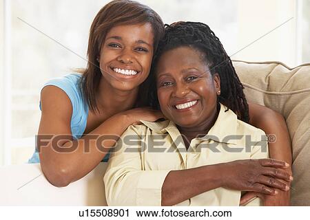 Stock Image - Woman With Her Teenage Daughter. Fotosearch