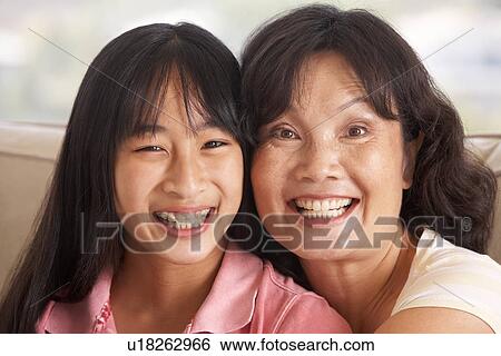 Stock Photograph - Woman With Her Teenage Daughter. Fotosearch