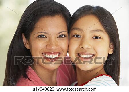 Stock Photograph - Woman With Her Young Daughter. Fotosearch