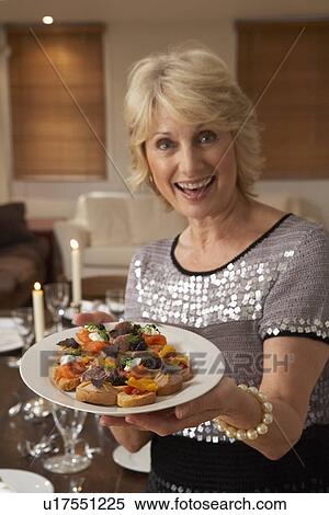 Woman With Hors D'oeuvres For A Dinner Party View Large Photo Image Stock Photography - Woman With Hors D'oeuvres For A Dinner Party. Fotosearch