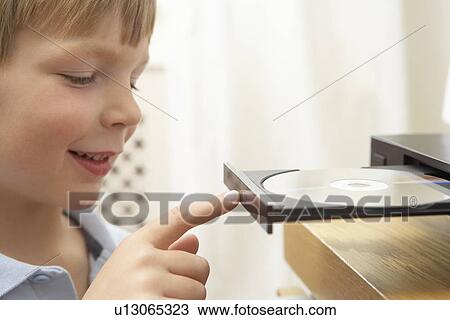 Young Boy Closing DVD Player With Finger View Large Photo Image Stock Image - Young Boy Closing DVD Player With Finger. Fotosearch