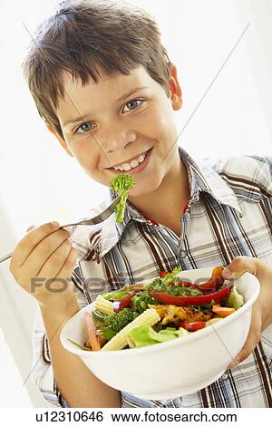 Young Boy Eating A Healthy Salad View Large Photo Image Stock Photograph - Young Boy Eating A Healthy Salad. Fotosearch