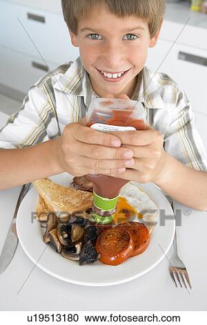 Young Boy Eating Unhealthy Fried Breakfast View Large Photo Image Stock Image - Young Boy Eating Unhealthy Fried Breakfast. Fotosearch