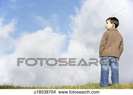 Young Boy Standing In The Park View Large Photo Image Picture - Young Boy Standing In The Park. Fotosearch